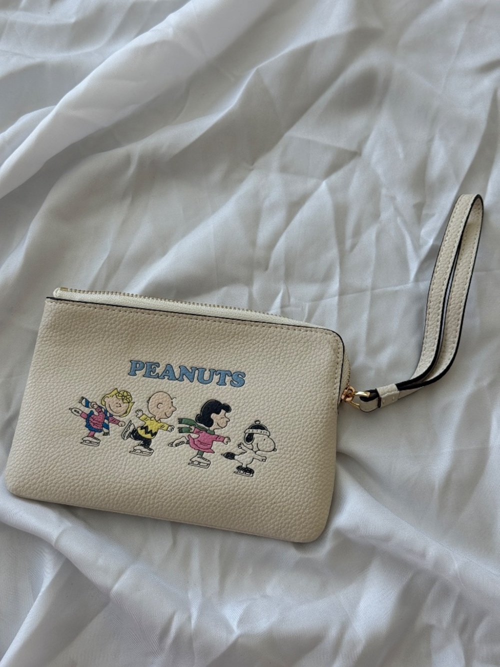 Coach x Peanuts Snoopy Ice Skating Leather Wristlet Cream